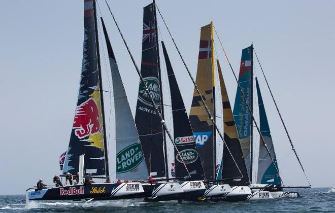 The fleet of GC32s look fierce as they charge across the start line on day one of racing in Muscat, Oman. © Lloyd Images